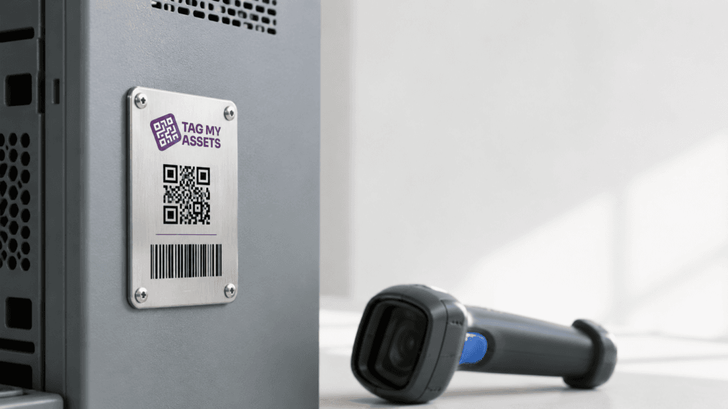 Metal asset tag with QR code and barcode fixed to a server cabinet, with a handheld scanner alongside